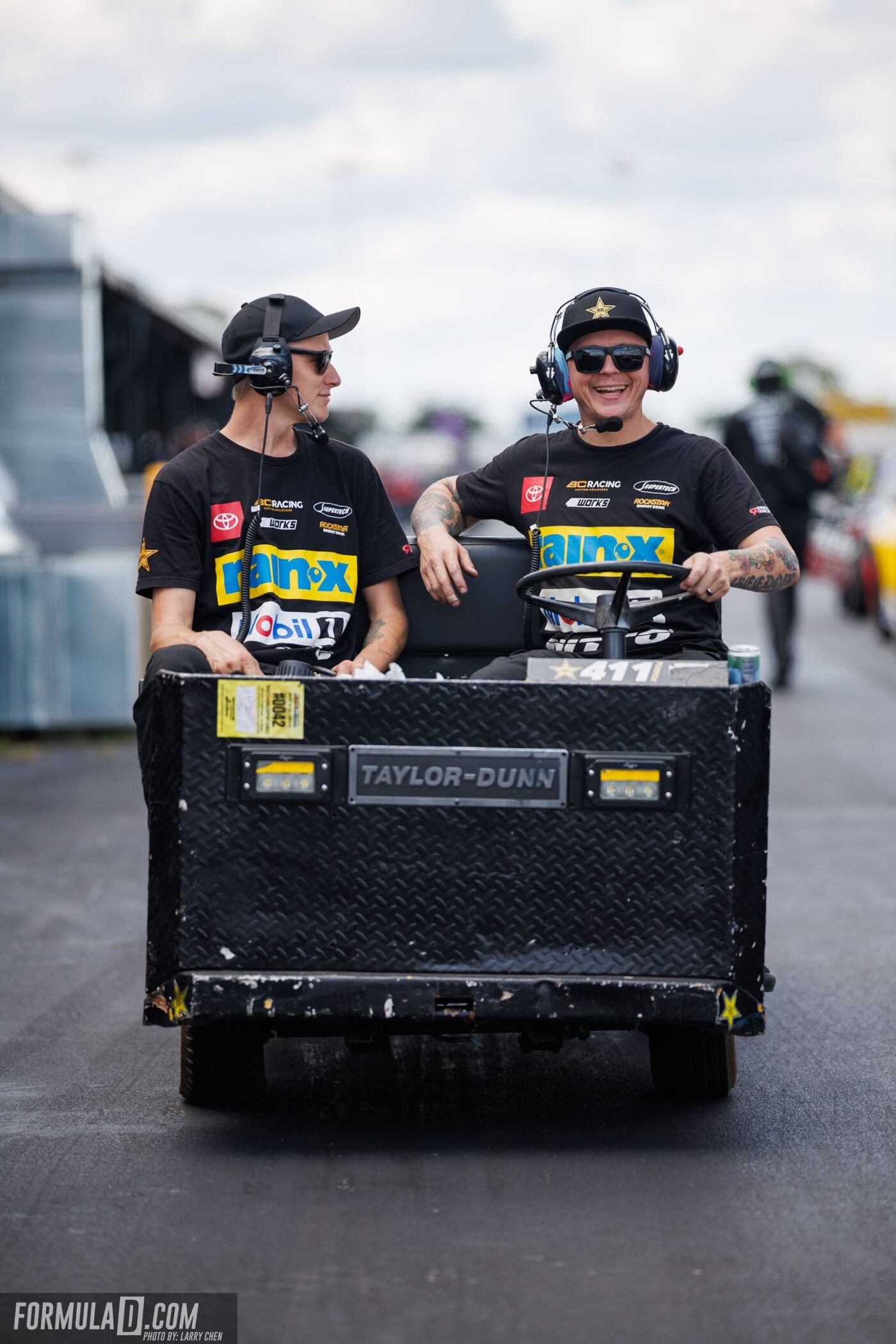 Tyler pushing a kart with his daughter