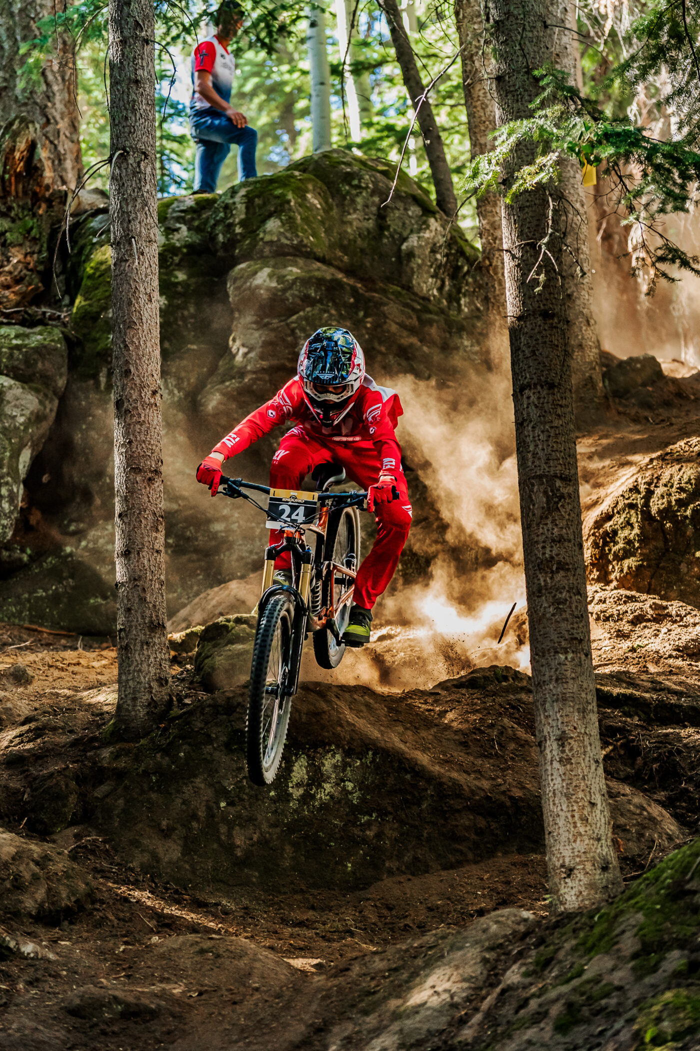 Tyler racing downhill on a mountain bike