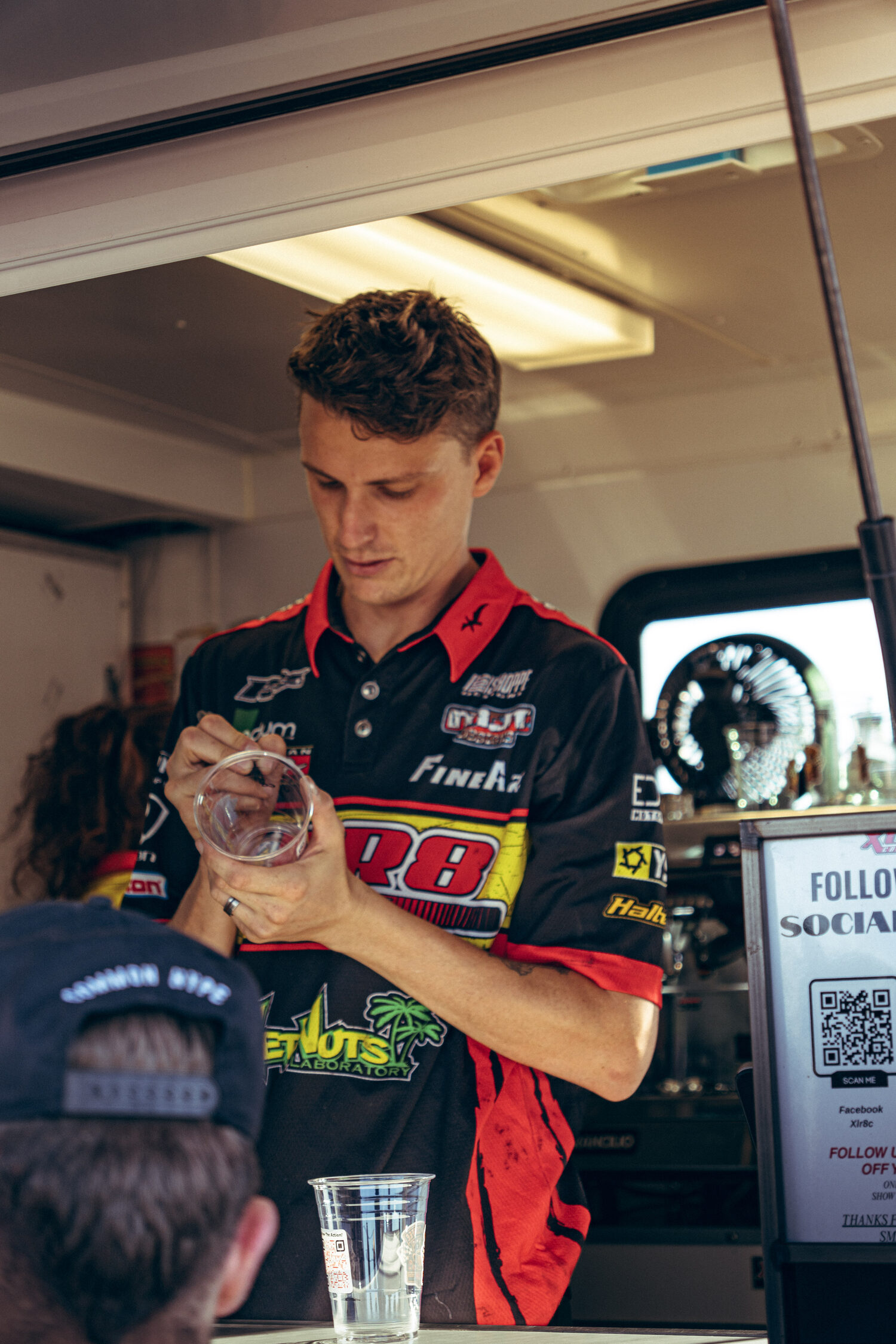 Tyler pulling coffee at the XLR8 trailer window